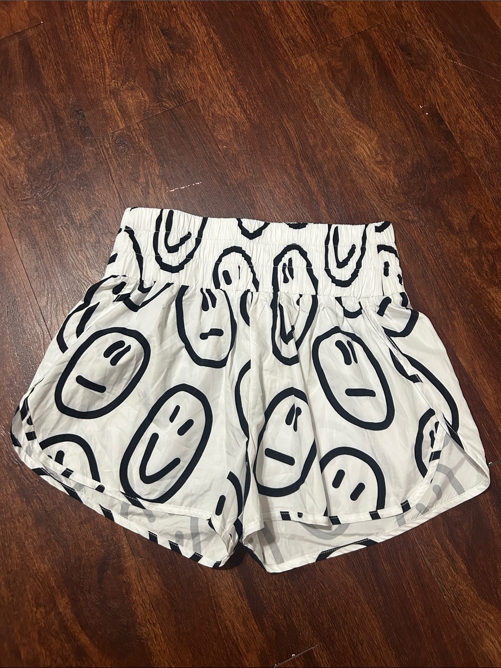 Main Strip White Athletic Shorts with Black Smiley Print
